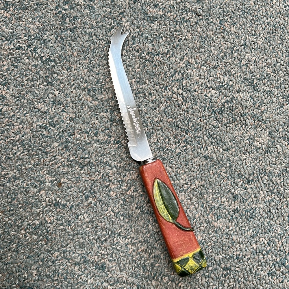 Joie de Vivre hooked blade cheese knife w carved leaf handle. Perfect addition !